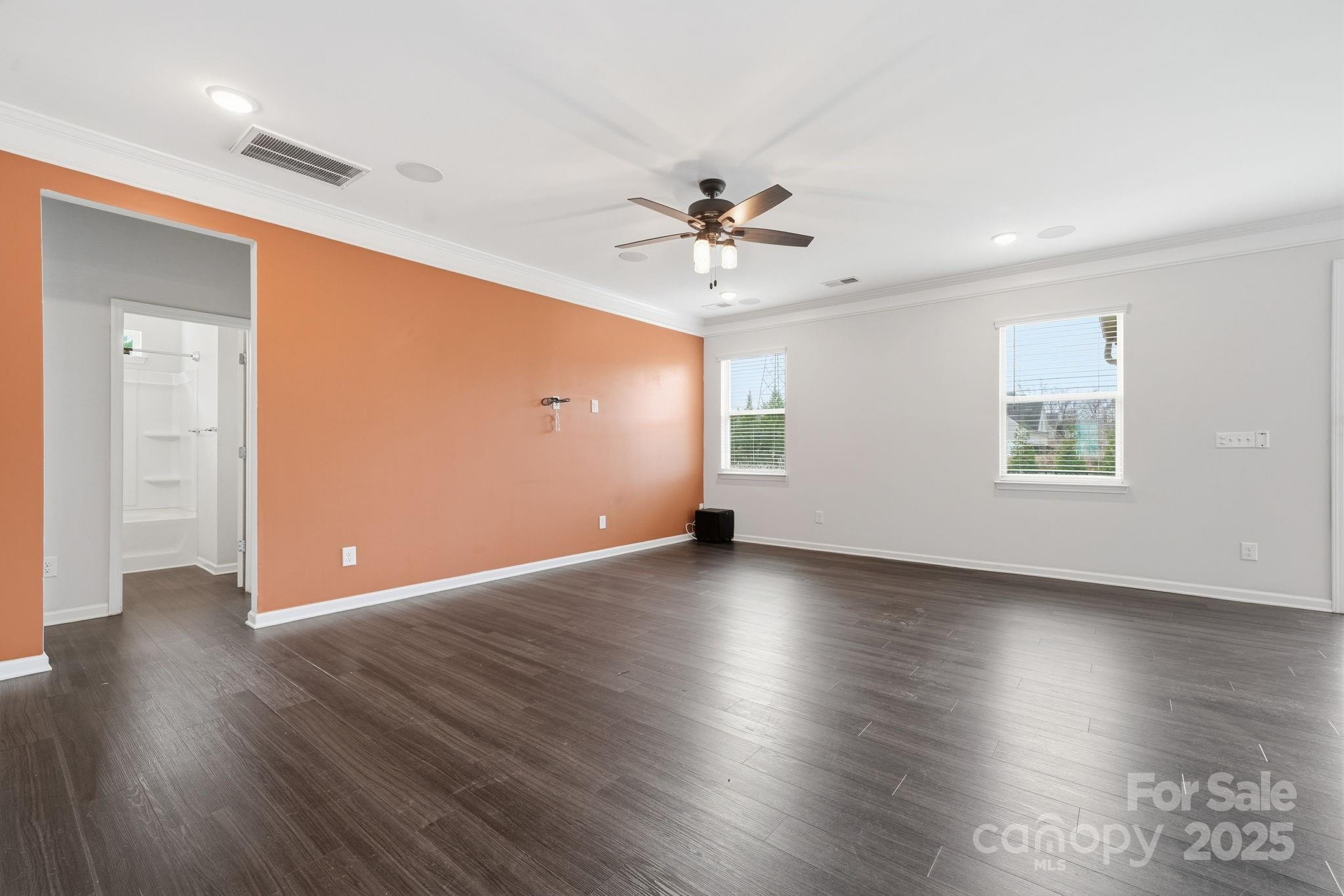 2612 Keady Mill Loop Kannapolis, NC 28081 - Photo 20 of 48 an empty room with wooden floor and windows