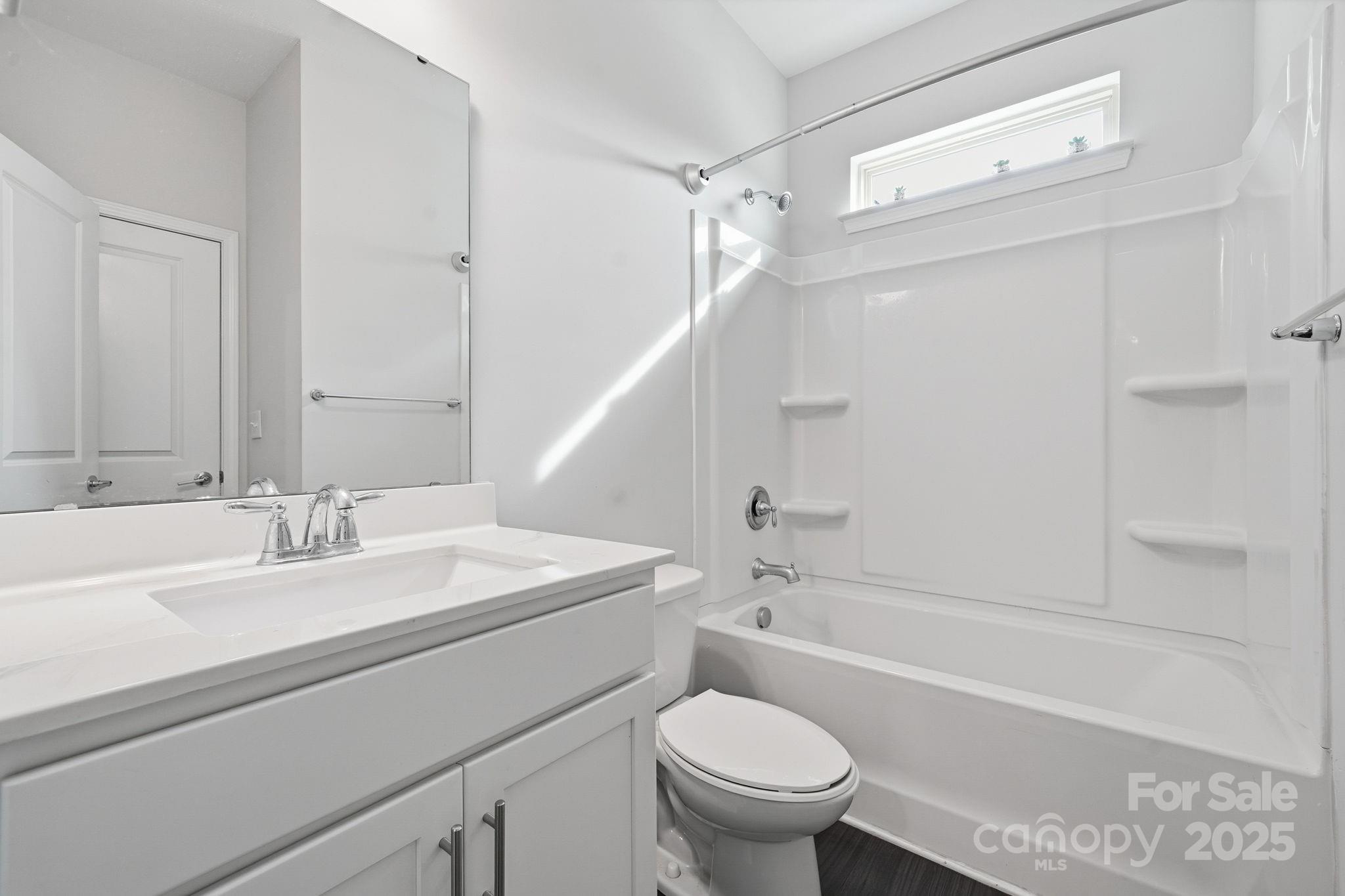 2612 Keady Mill Loop Kannapolis, NC 28081 - Photo 24 of 48 a bathroom with a sink toilet vanity and shower