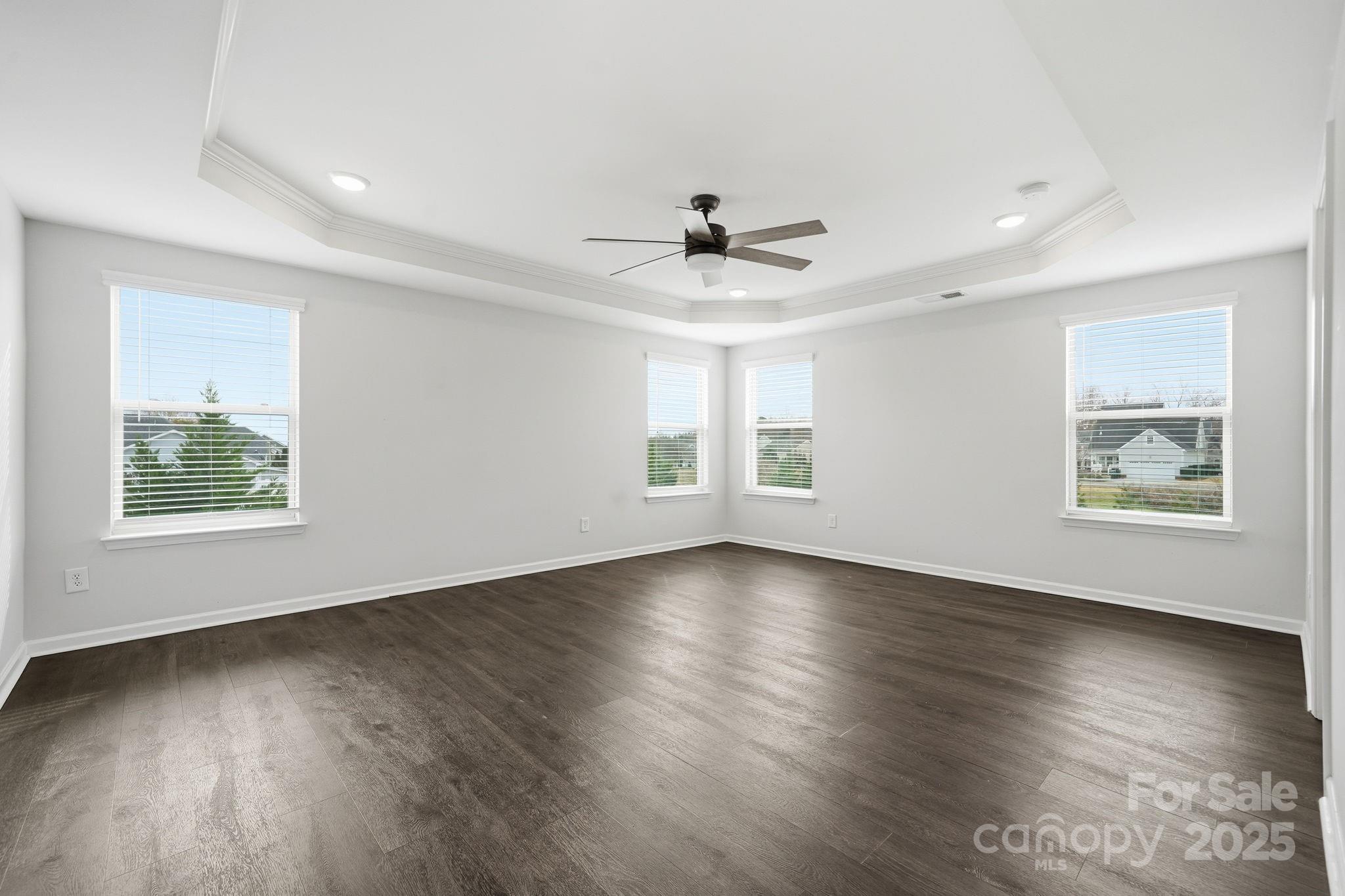 2612 Keady Mill Loop Kannapolis, NC 28081 - Photo 27 of 48 a view of an empty room with wooden floor and a window