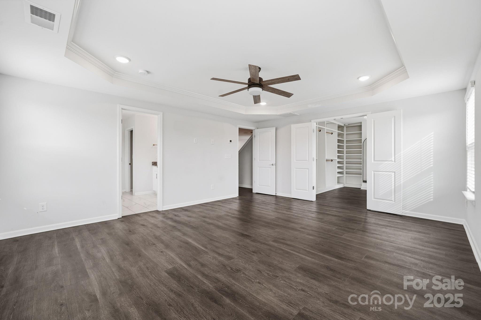 2612 Keady Mill Loop Kannapolis, NC 28081 - Photo 29 of 48 a view of an empty room with a window and wooden floor
