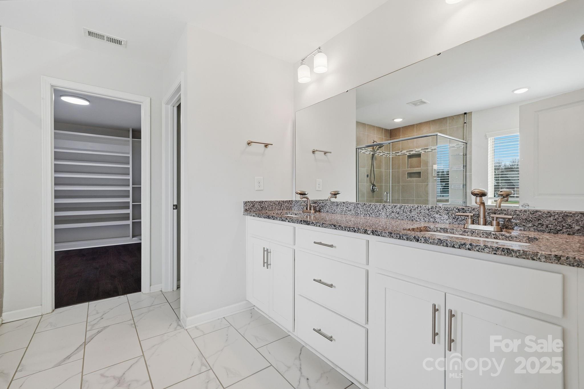 2612 Keady Mill Loop Kannapolis, NC 28081 - Photo 31 of 48 a bathroom with a granite countertop sink and a mirror