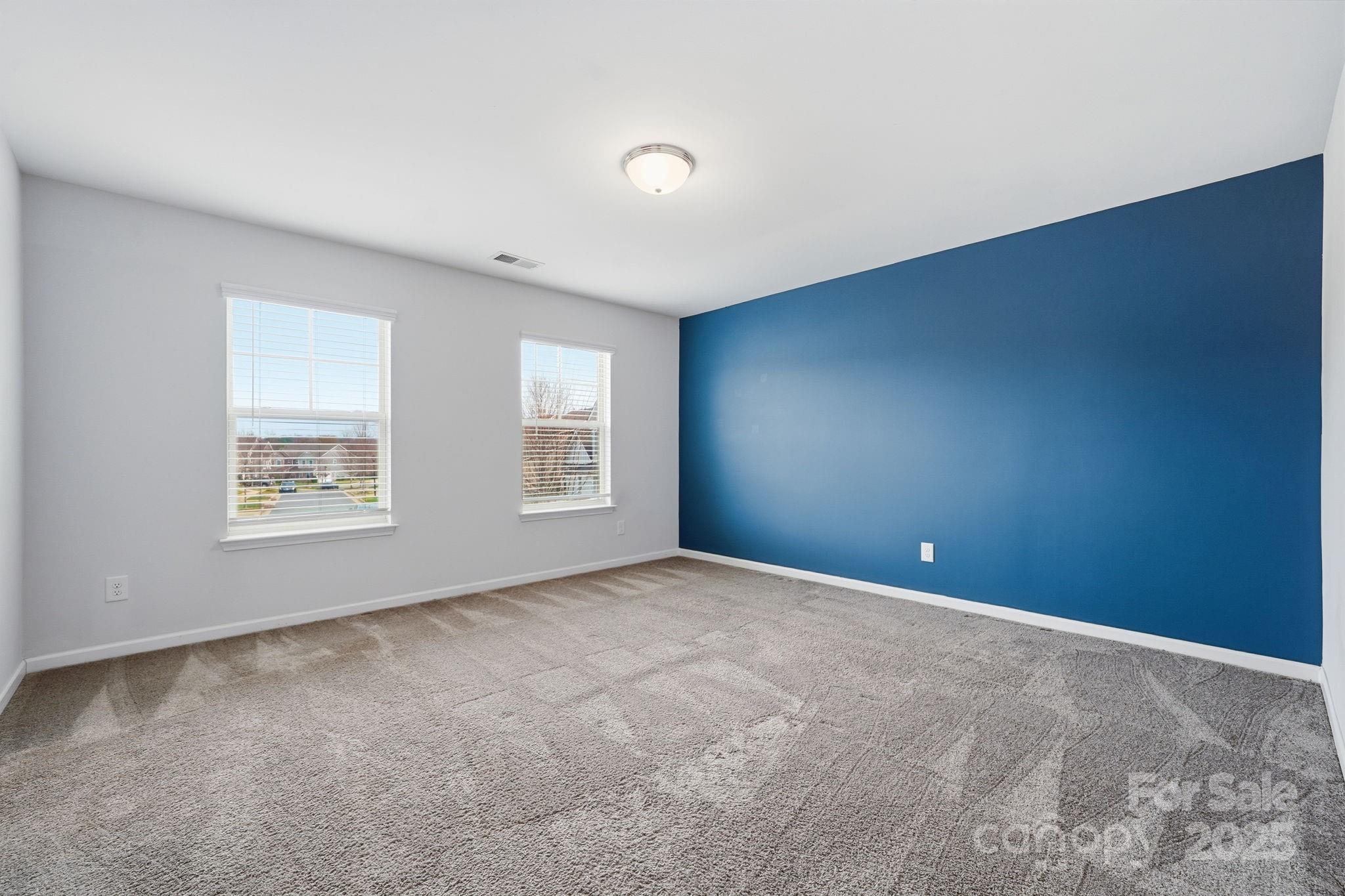 2612 Keady Mill Loop Kannapolis, NC 28081 - Photo 36 of 48 an empty room with windows and closet