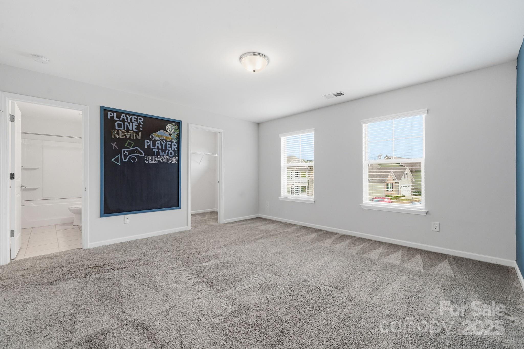 2612 Keady Mill Loop Kannapolis, NC 28081 - Photo 37 of 48 an empty room with windows and closet