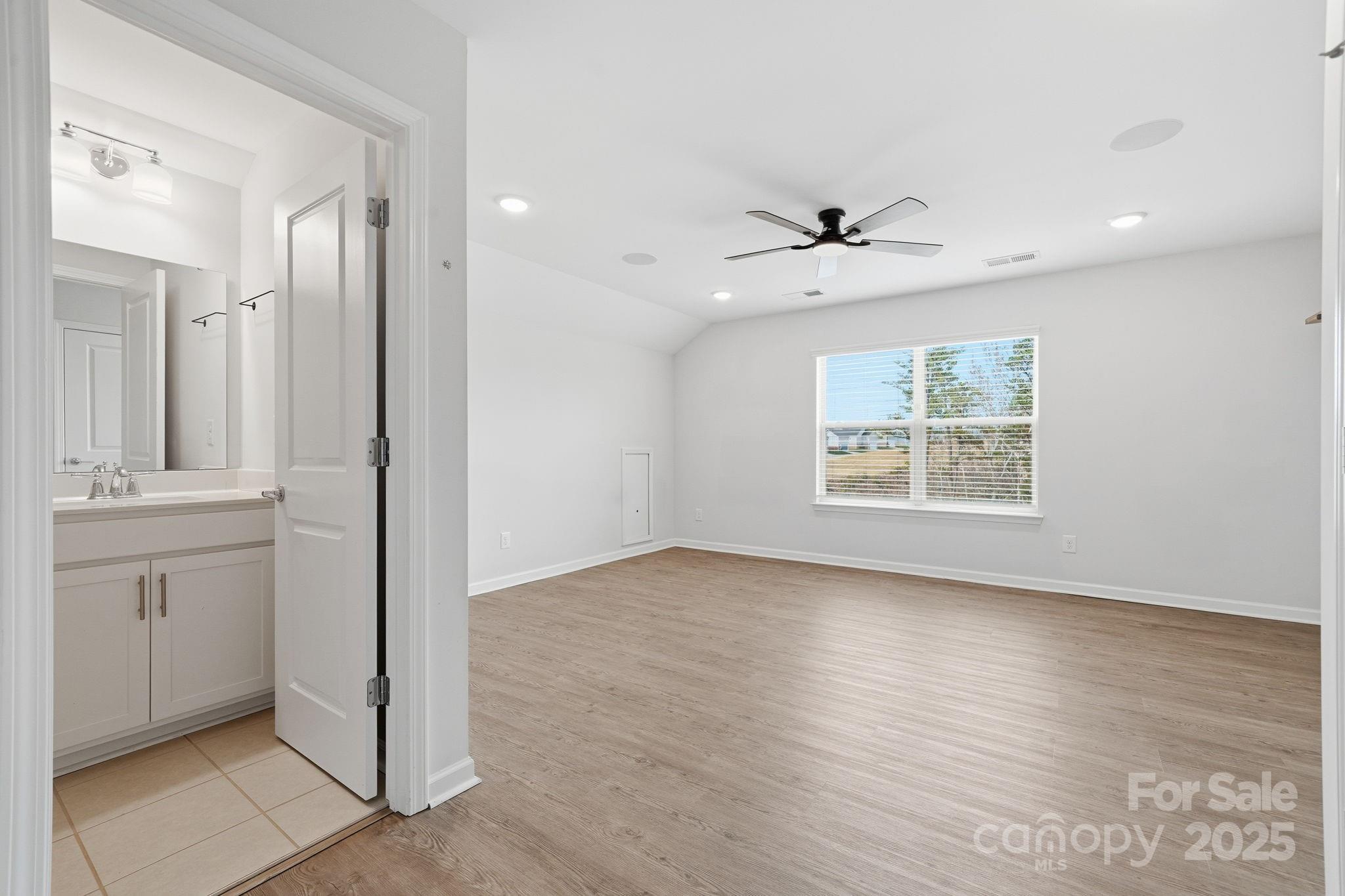 2612 Keady Mill Loop Kannapolis, NC 28081 - Photo 38 of 48 wooden floor in an empty room with a window