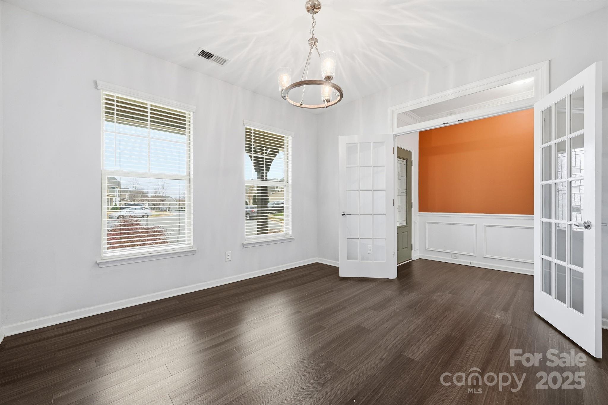 2612 Keady Mill Loop Kannapolis, NC 28081 - Photo 4 of 48 a view of an empty room with wooden floor and a window