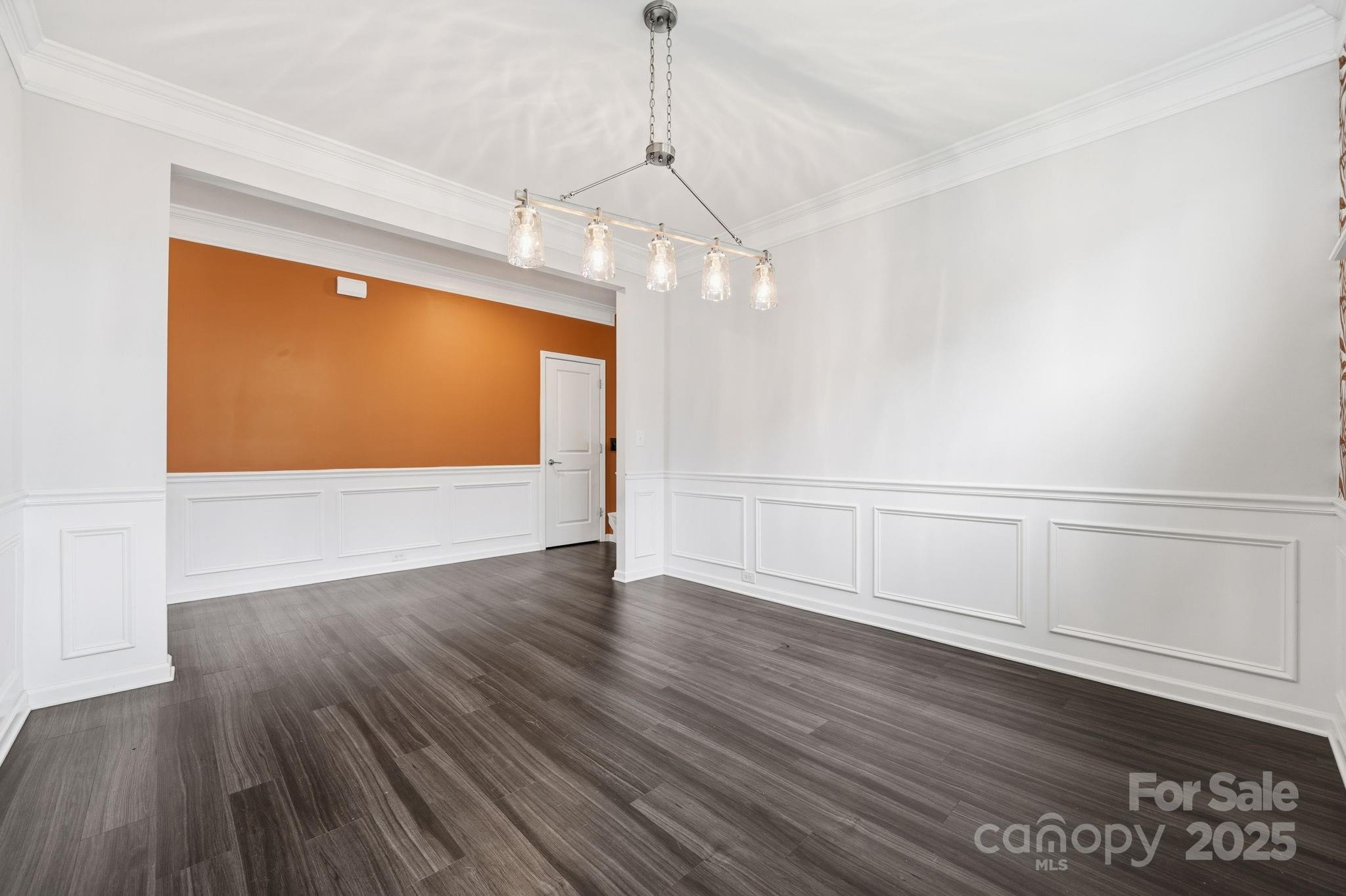 2612 Keady Mill Loop Kannapolis, NC 28081 - Photo 5 of 48 a view of an empty room with wooden floor and a window