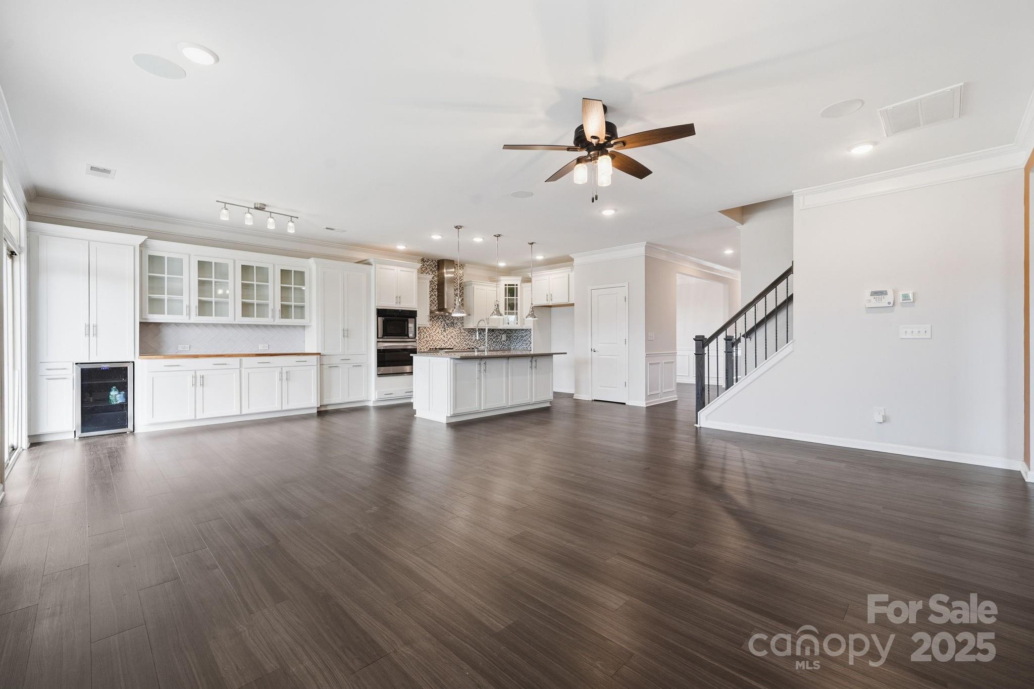 2612 Keady Mill Loop Kannapolis, NC 28081 - Photo 9 of 48 a view of a kitchen with a sink and dishwasher wooden floor