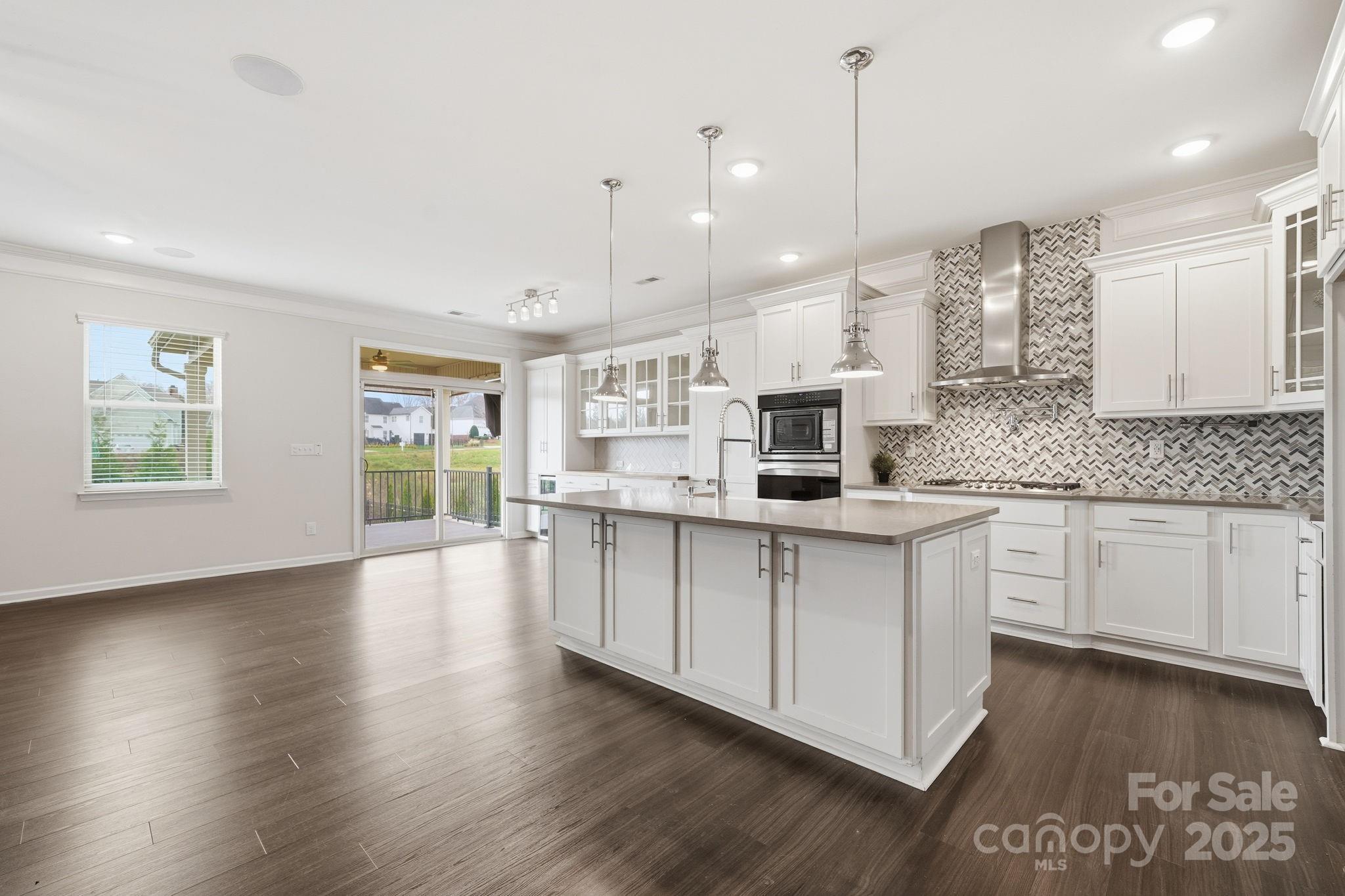 2612 Keady Mill Loop Kannapolis, NC 28081 - Photo 10 of 48 a large white kitchen with lots of counter space sink and cabinets