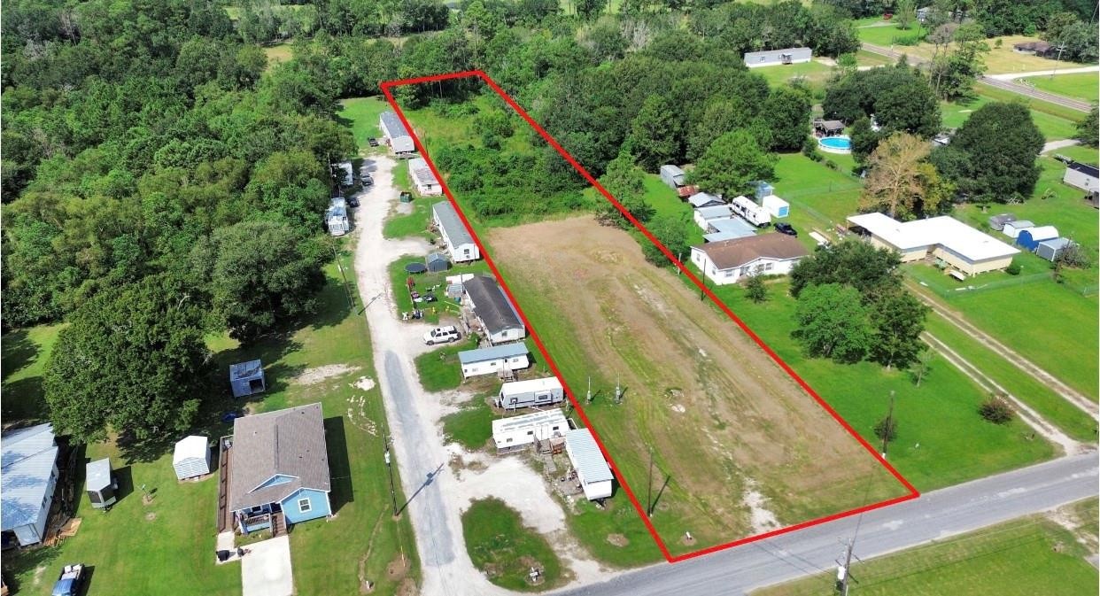 710 9th Street Winnie, TX 77665 - Photo 3 of 3 a view of swimming pool with a garden and plants