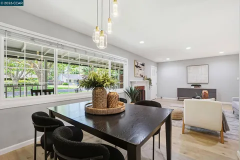 a view of a dining room with furniture window and outside view