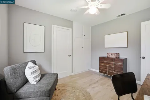 a bedroom with a bed and couch