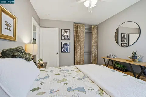 a bedroom with bed and a chandelier