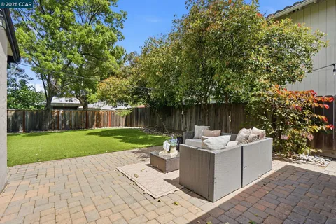 a view of a patio with couches and potted plants