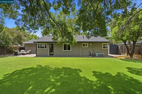 a view of a backyard with a small cabin