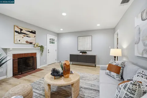 a bedroom with furniture and a fireplace
