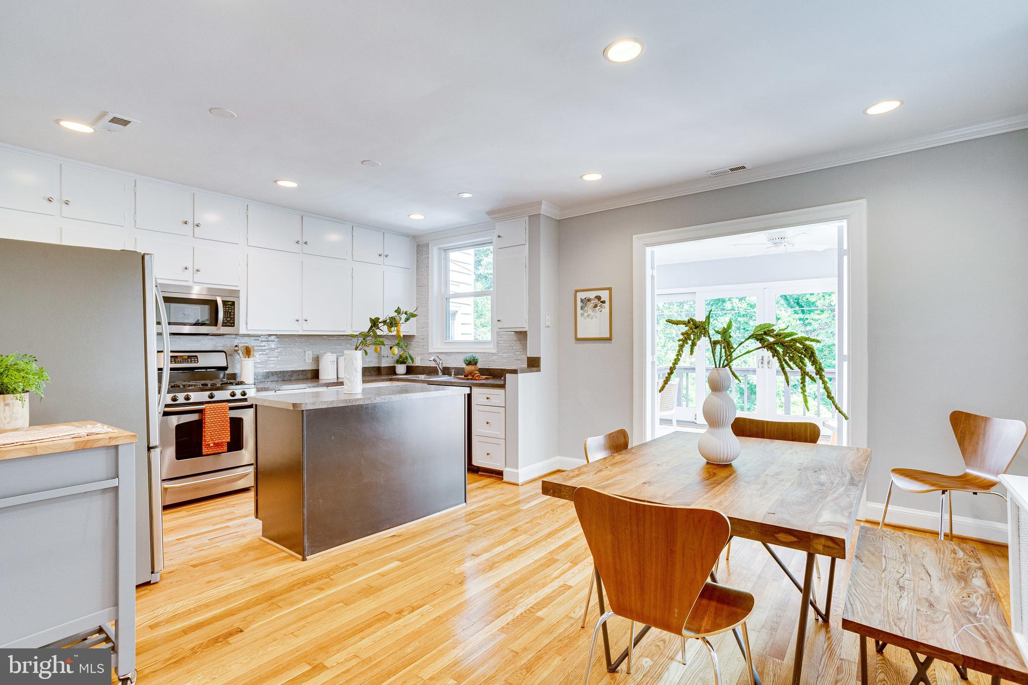 1563 44th Street Northwest Washington, DC 20007 - Photo 9 of 46 Open DR/kitchen with island & sunroom beyond