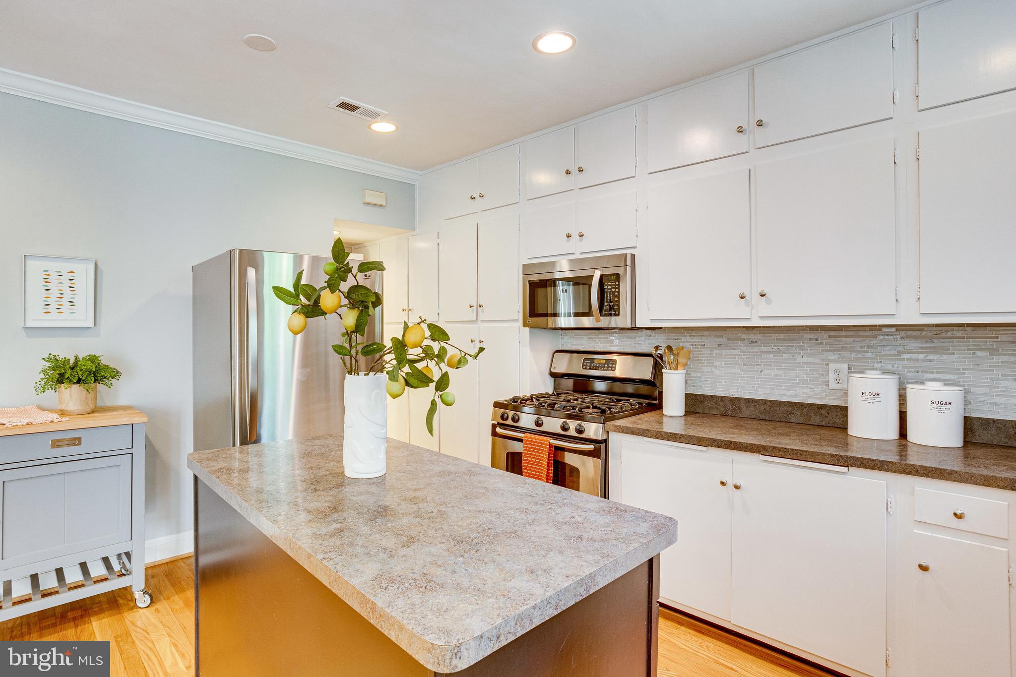 1563 44th Street Northwest Washington, DC 20007 - Photo 12 of 46 Kitchen with wall of cabinets