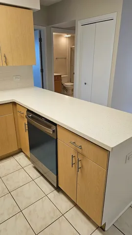 a view of a storage and utility room with washer and dryer