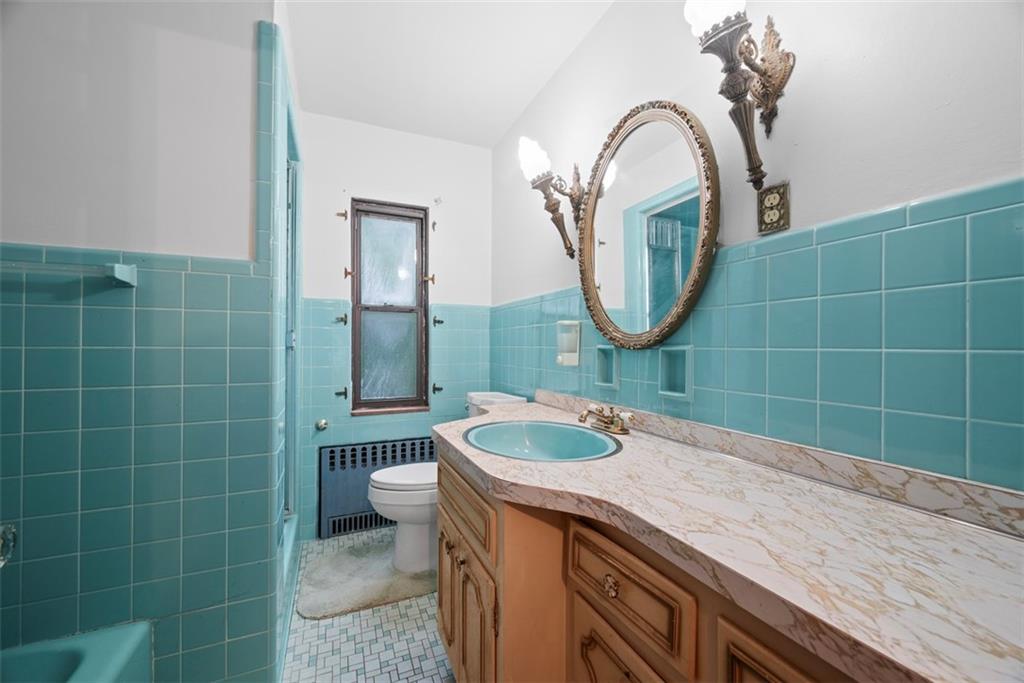 835 Charles Street Carnegie, PA 15106 - Photo 25 of 35 a bathroom with a sink a toilet and a mirror