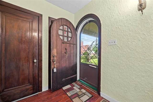a view of an entryway with wooden floor