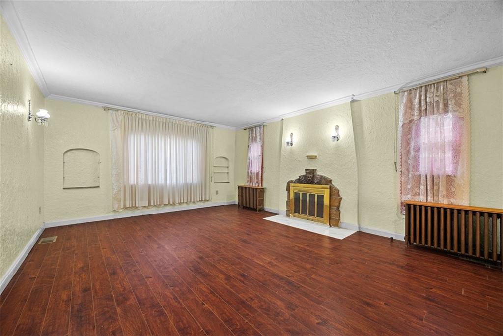 835 Charles Street Carnegie, PA 15106 - Photo 8 of 35 a big room with wooden floor and windows