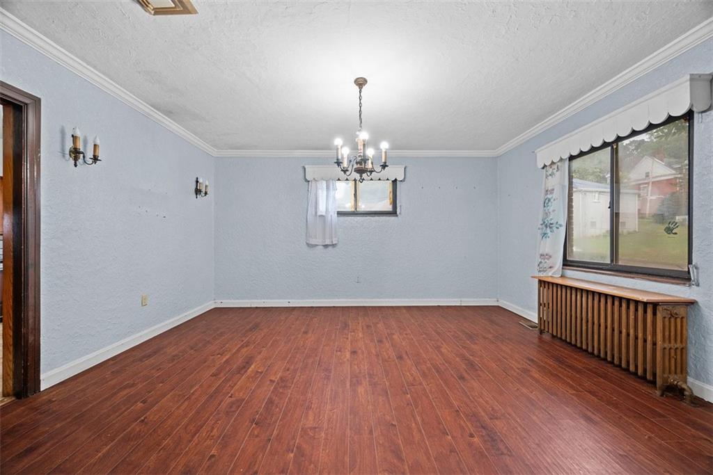 835 Charles Street Carnegie, PA 15106 - Photo 10 of 35 wooden floor in an empty room with a window