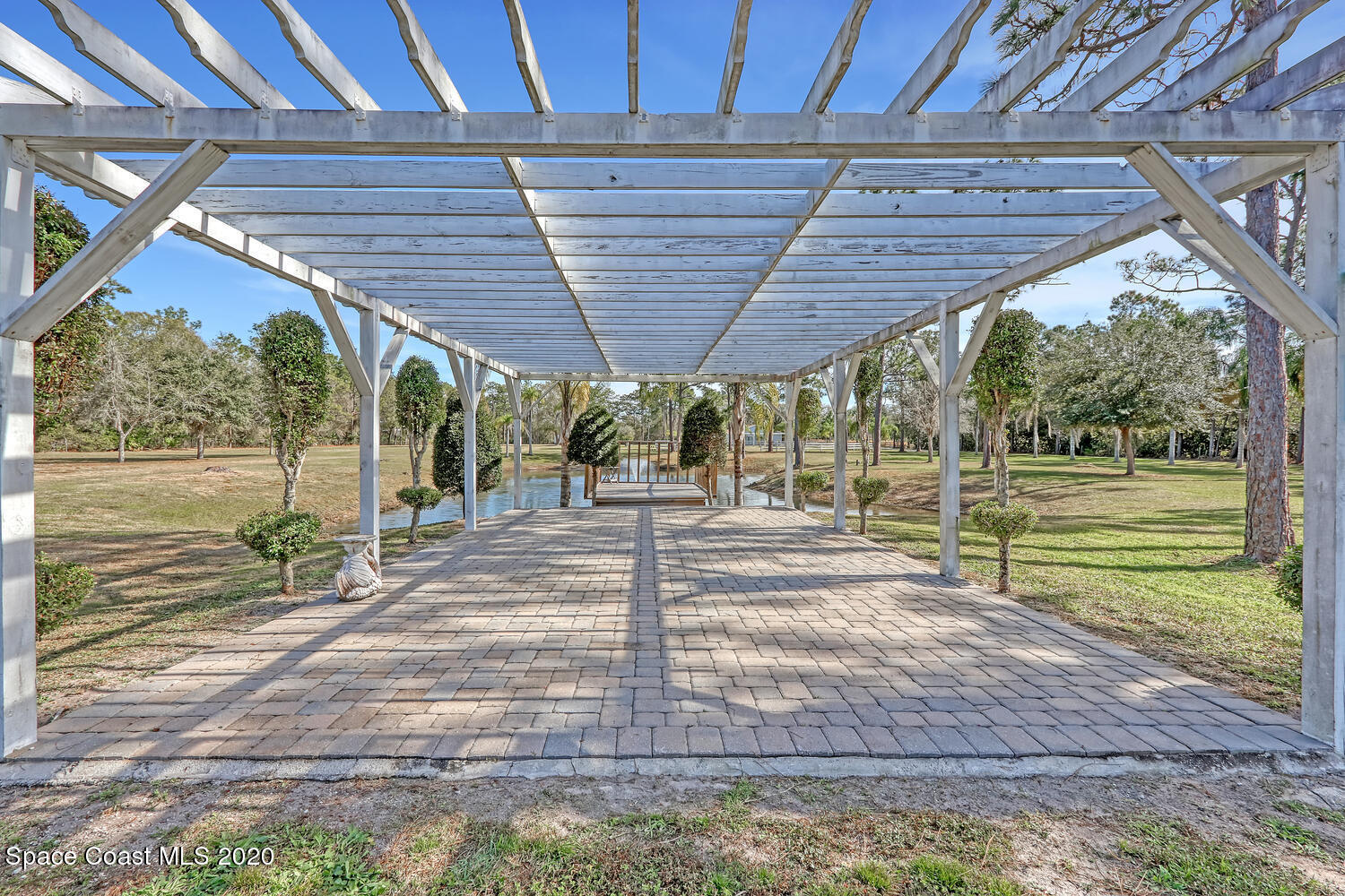 4370 Albritton Road St. Cloud, FL 34772 - Photo 42 of 82 Pergola with deck at pond