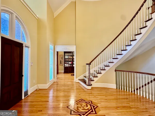 a view of a dining room with furniture and wooden floor