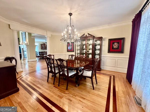 a living room with fireplace furniture and a flat screen tv