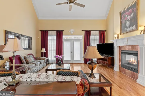 a living room with furniture and a flat screen tv