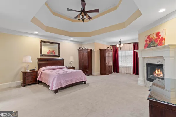 a spacious bathroom with a double vanity sink a large mirror and a shower