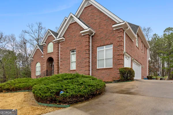 a front view of a house with a yard