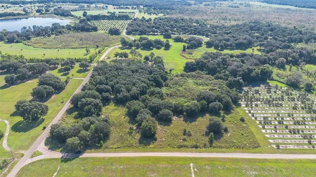 a view of a brick house with a yard