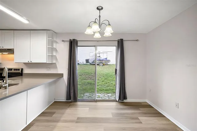 a view of a kitchen with a sink and a window