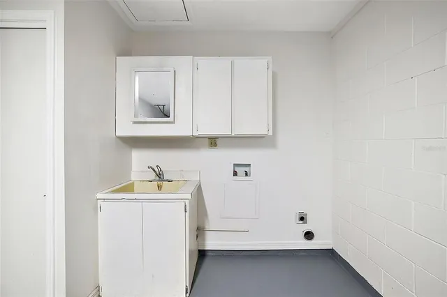 a bathroom with a sink and cabinets