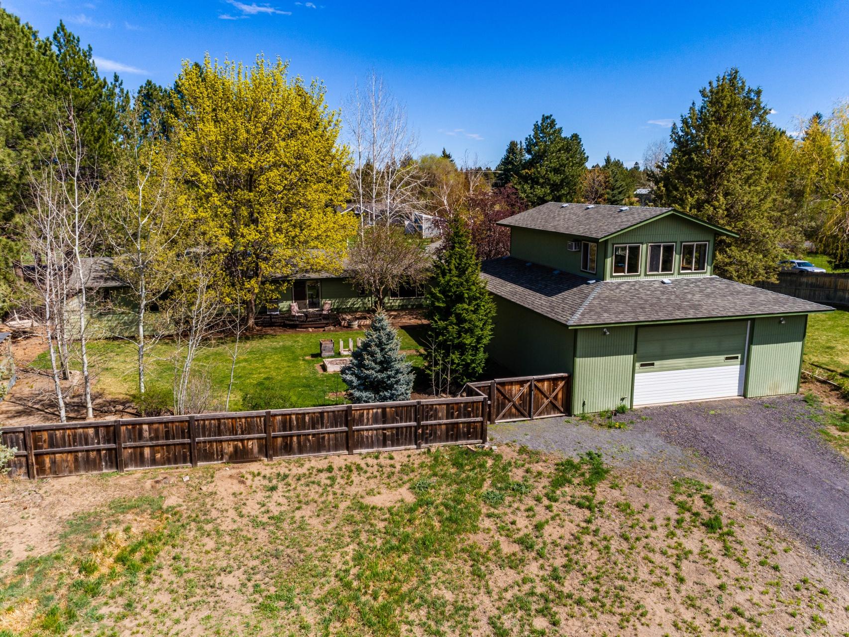 61919 Dobbin Road Bend, OR 97702 - Photo 56 of 57 a view of a house with a wooden fence