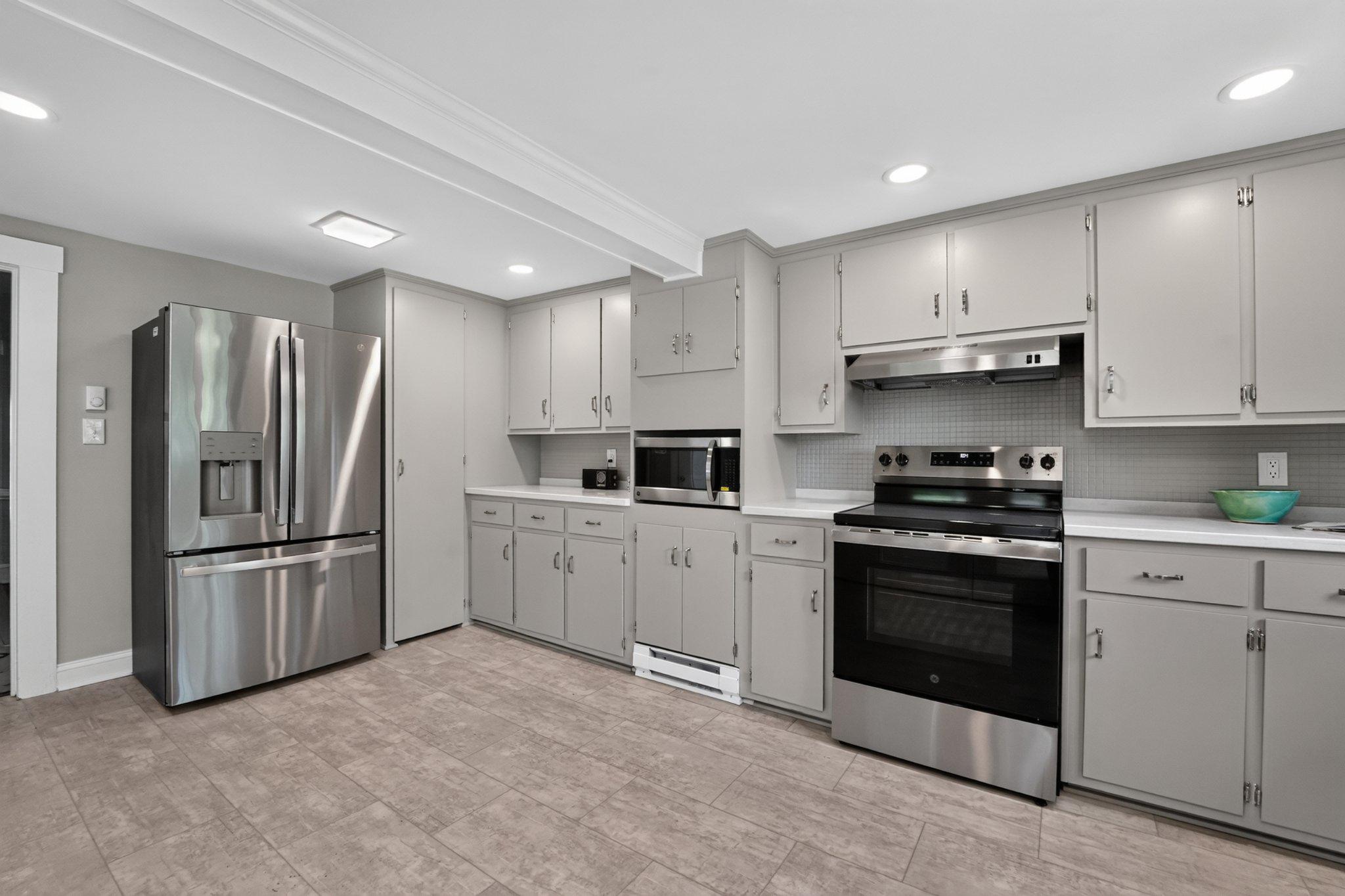 300 Woods Point Road Chester, MD 21619 - Photo 28 of 78 Modern kitchen with painted cabinetry