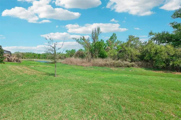 a view of an house with backyard space and garden