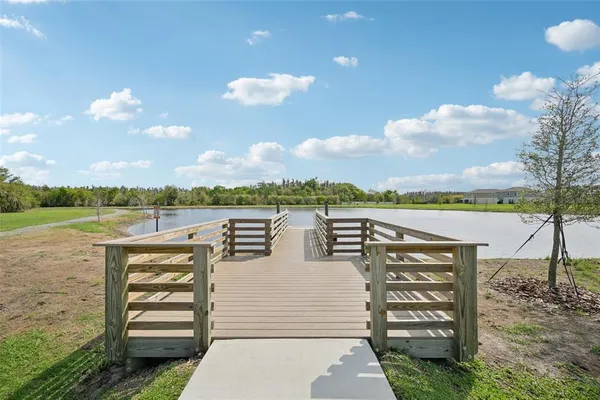 a view of a swimming pool and a yard