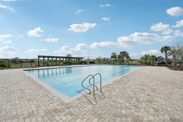 a dining room with furniture water view and a garden
