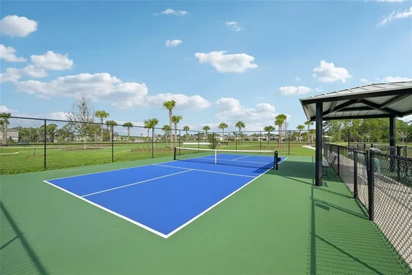 a picture of a room with a white wall and white cabinet