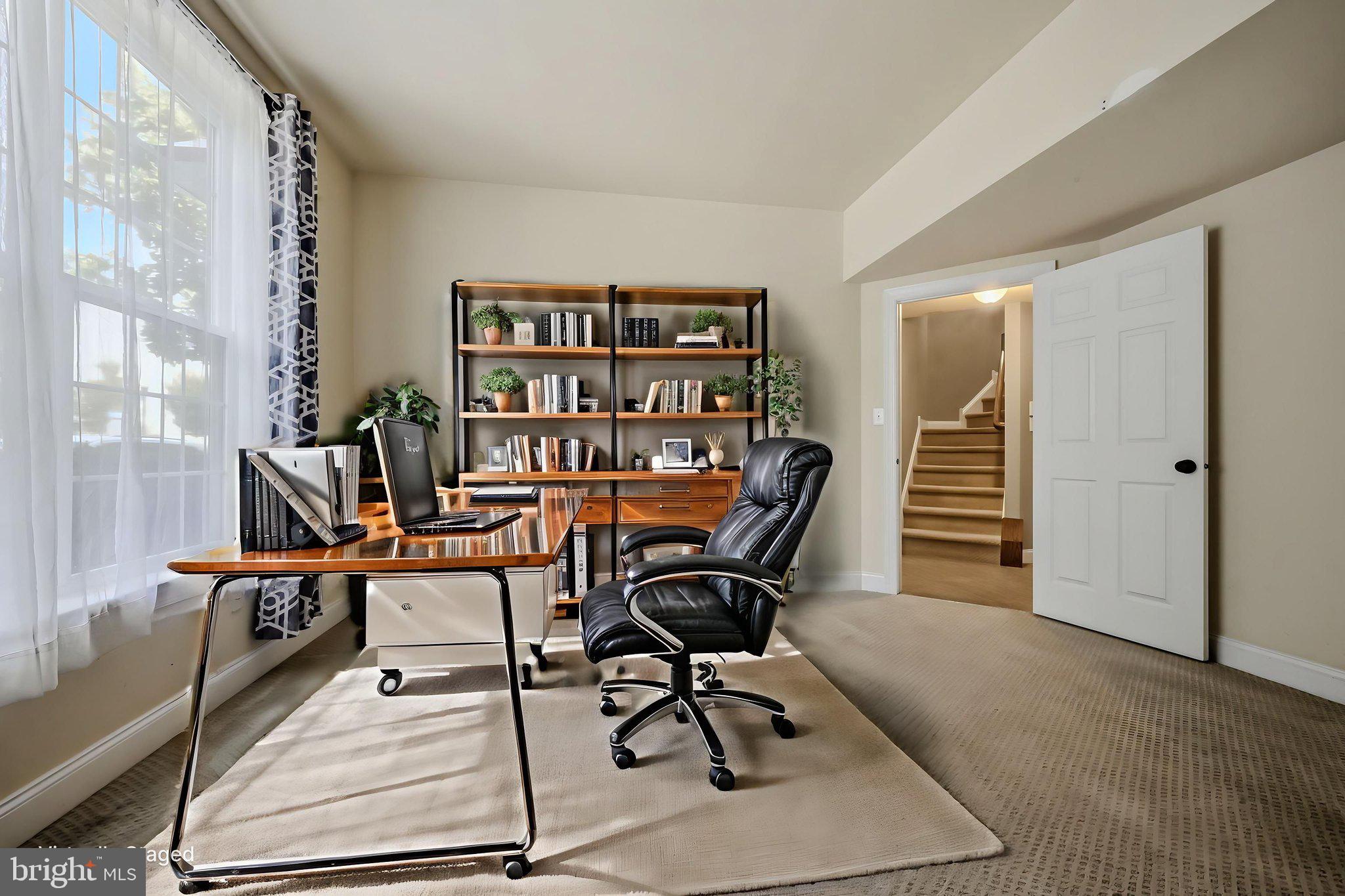 208 Jackdaw Alley, Unit 208 Springfield, PA 19064 - Photo 9 of 49 a view of a workspace with furniture and a bookshelf