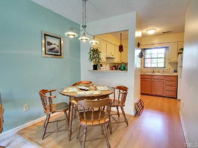 103 Shady Spring Place Durham, NC 27713 - Photo 6 of 12 Kitchen opens to dining area.