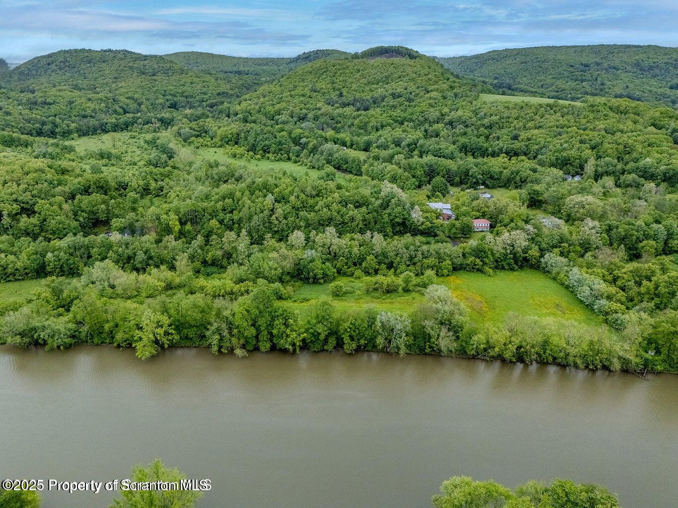 436 State Line Road Susquehanna, PA 18847 - Photo 13 of 13 an aerial view of a houses with a lake view