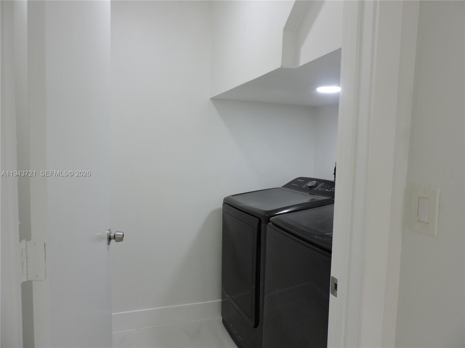 17975 Southwest 140th Court, Unit 17975 Miami, FL 33177 - Photo 15 of 27 a utility room with dryer and washer