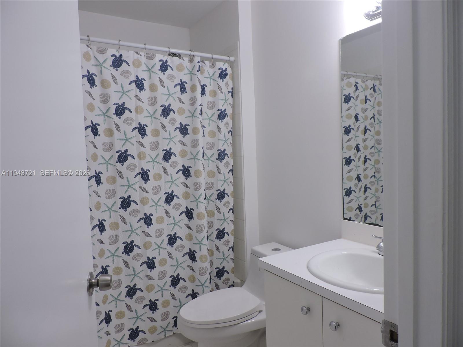17975 Southwest 140th Court, Unit 17975 Miami, FL 33177 - Photo 25 of 27 a bathroom with a sink toilet and shower