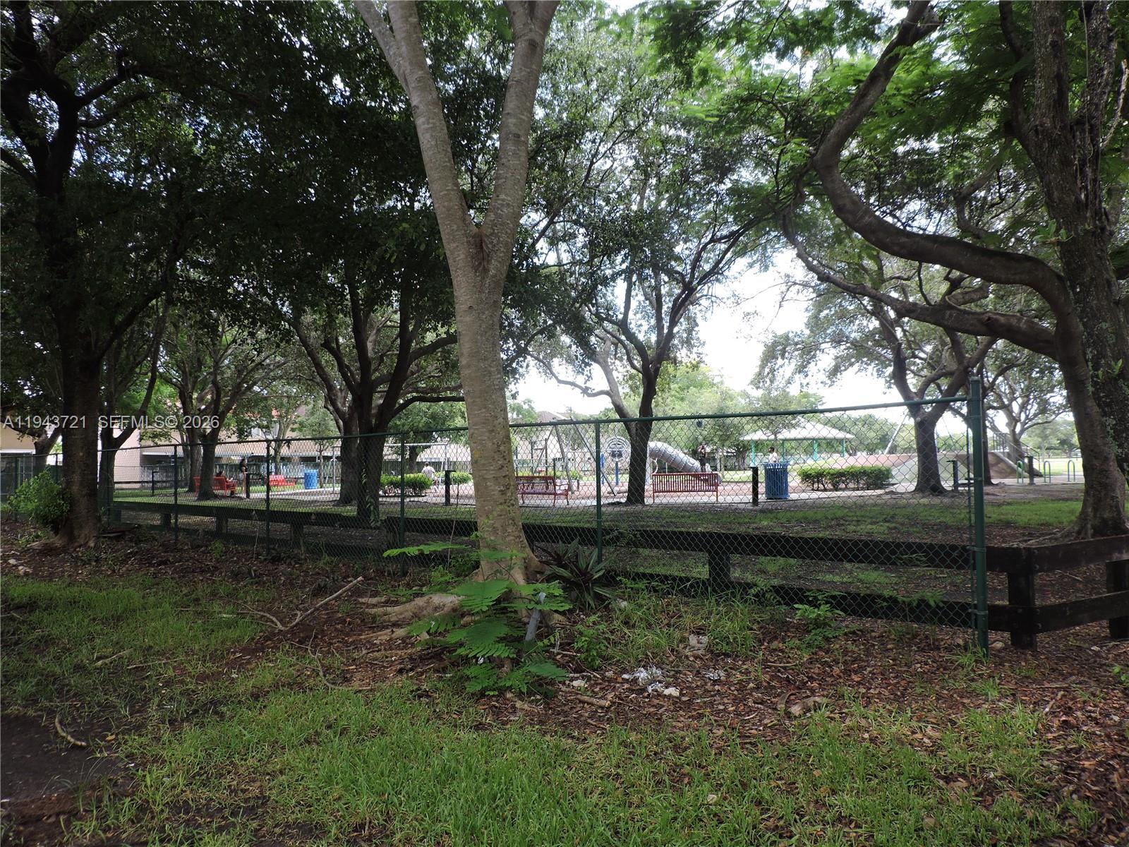 17975 Southwest 140th Court, Unit 17975 Miami, FL 33177 - Photo 4 of 27 a backyard of a house with lots of green space
