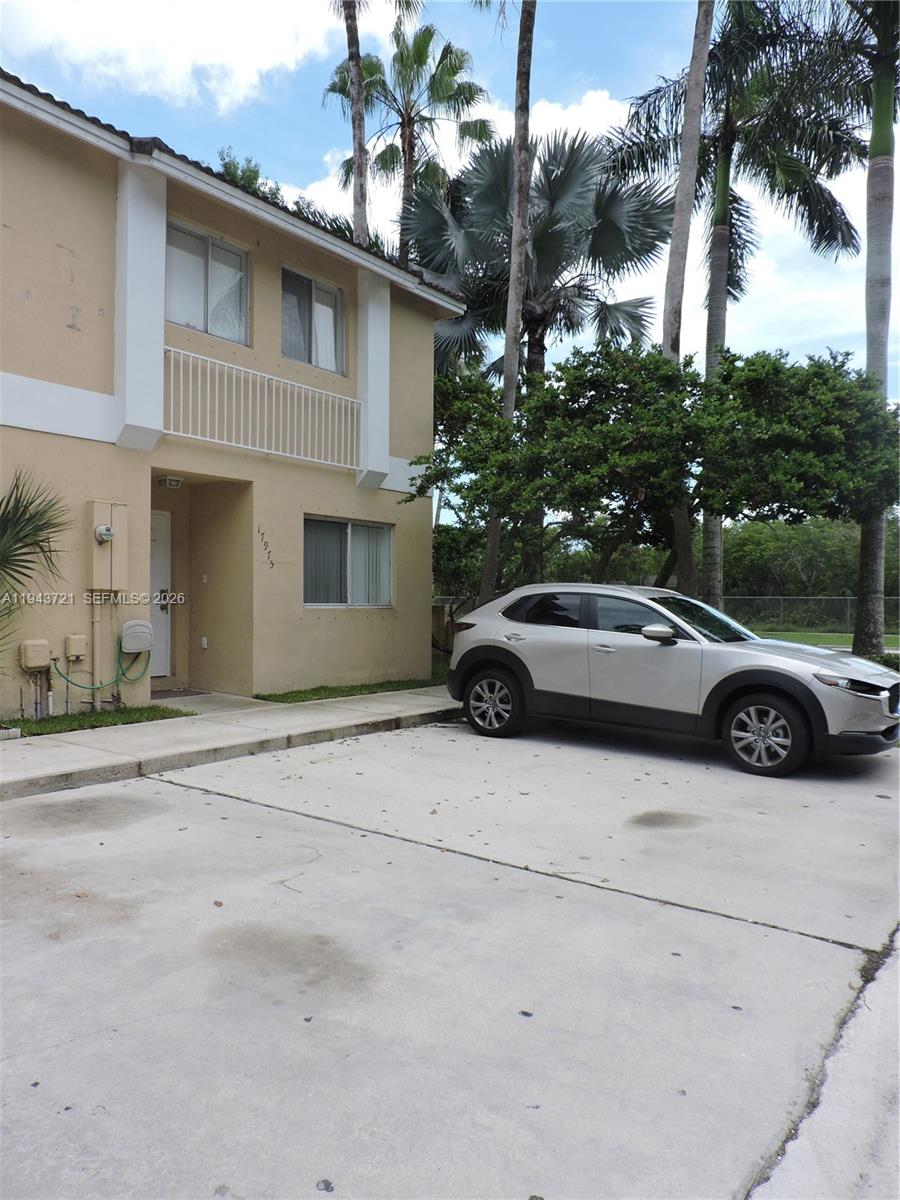 17975 Southwest 140th Court, Unit 17975 Miami, FL 33177 - Photo 7 of 27 a view of a car parked front of a house