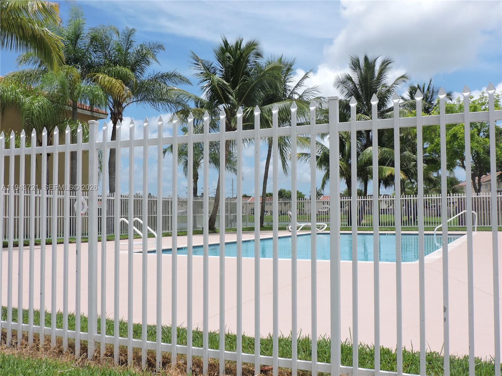 17975 Southwest 140th Court, Unit 17975 Miami, FL 33177 - Photo 8 of 27 a view of a house with a wooden fence