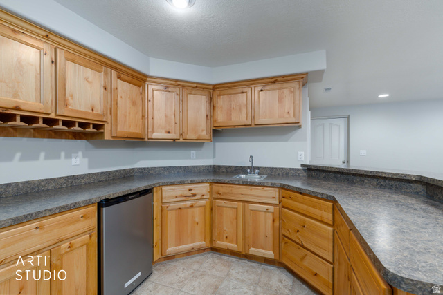 2327 Bluff Ridge Drive Syracuse, UT 84075 - Photo 29 of 66 Kitchenette featuring light wood cabinetry, a stainless steel beverage refrigerator, a stainless steel sink with a chrome faucet, and speckled gray countertops